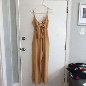 Adorable mustard romper from PRIMP Size Small